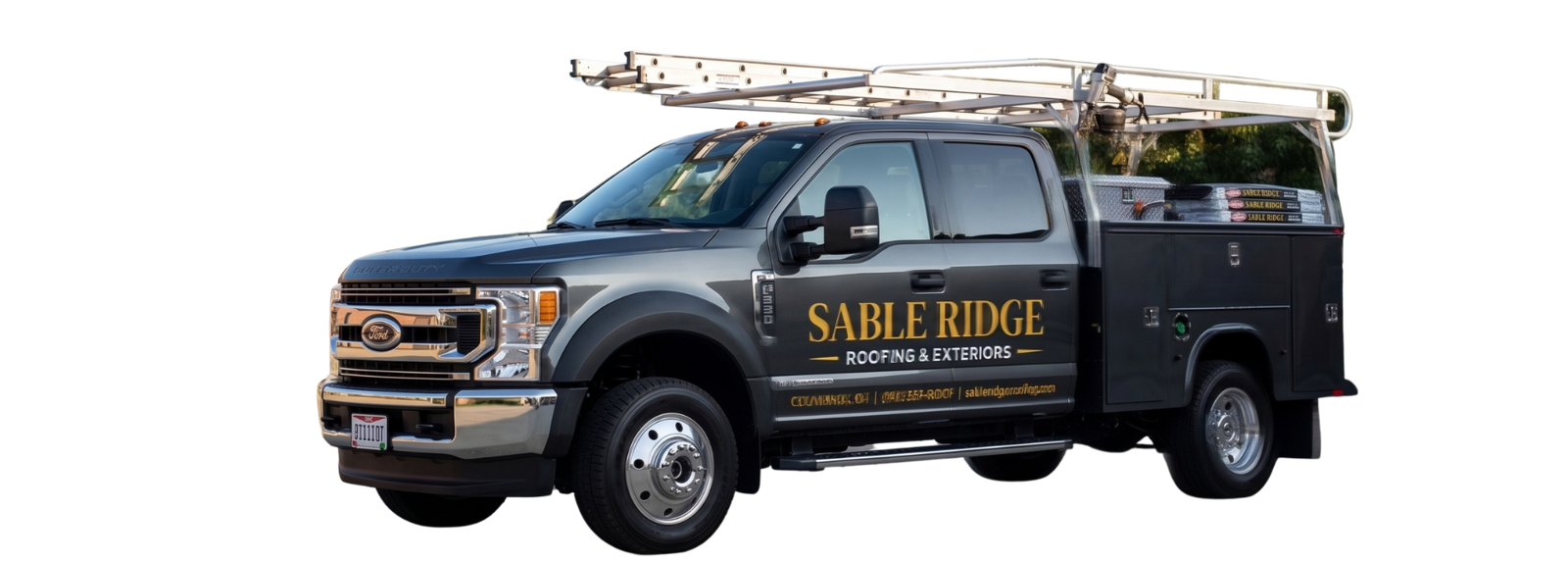 A Sable Ridge Roofing & Exteriors service truck, ladder rack loaded, lettered on the door
