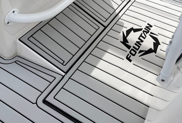 Professional marine flooring installation with non-slip foam being applied to boat decking