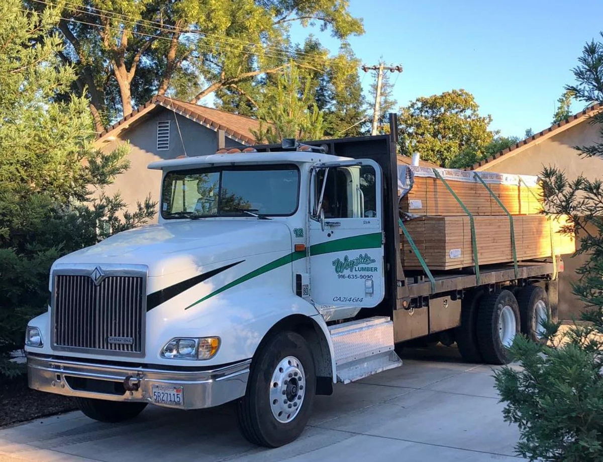 A Wayside Lumber delivery truck loaded with decking material