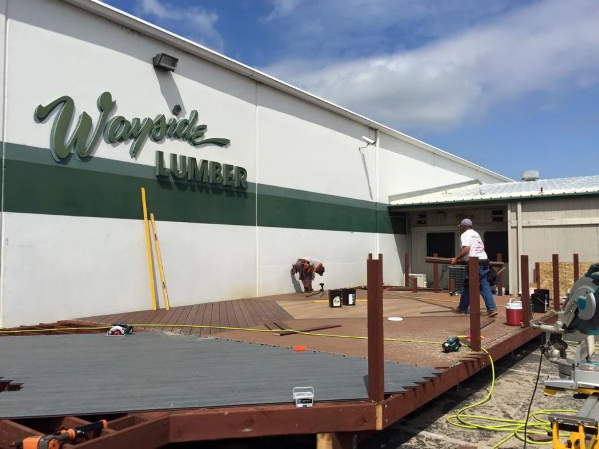 The Wayside Lumber yard in Rancho Cordova, crew building a display deck out front